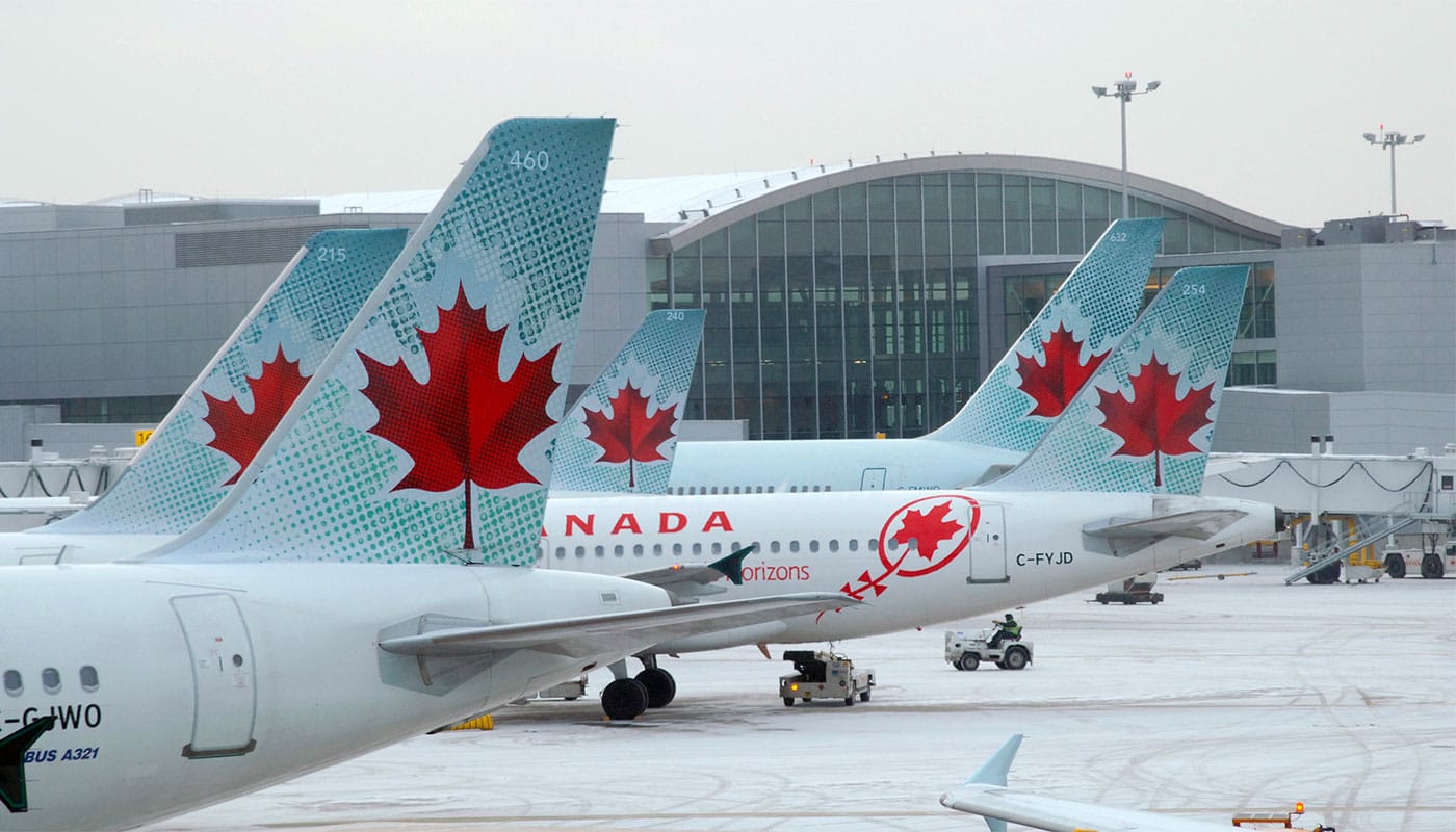 Air Canada airplanes at airport in winter.