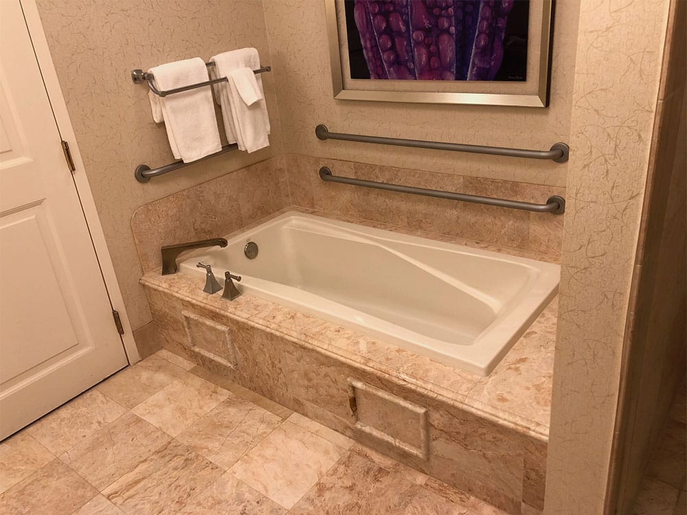 Bathtub with grab bars.