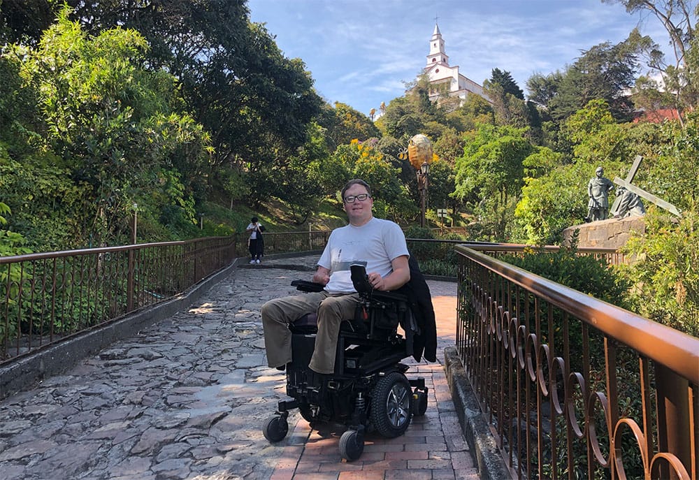 Posing for a photo on the wheelchair accessible path up Monserrate.