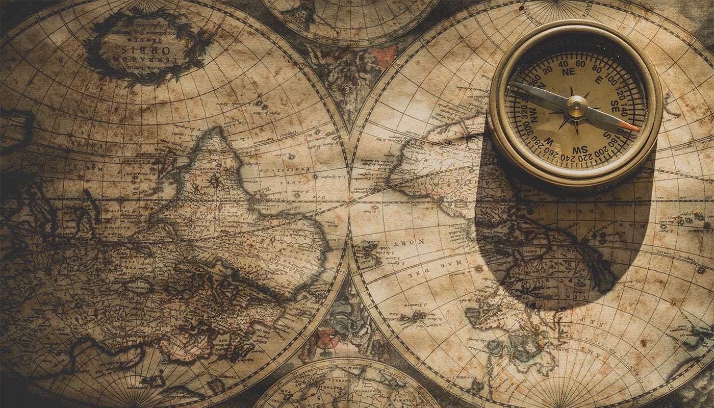 Historic world map with compass.