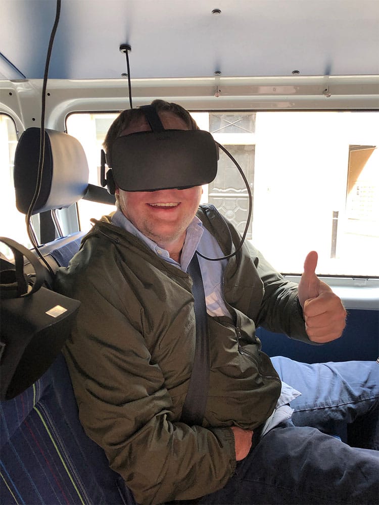 Wearing the Oculus Rift VR headset.