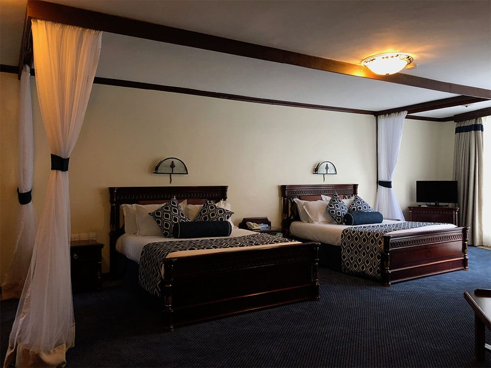 Two queen beds in spacious room.