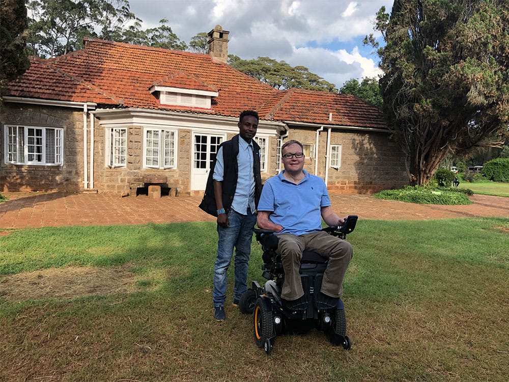 Photo with guide at Blixen Museum.