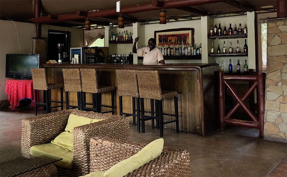 My favorite bartender, Fred, behind the bar at Ashnil Mara Camp.