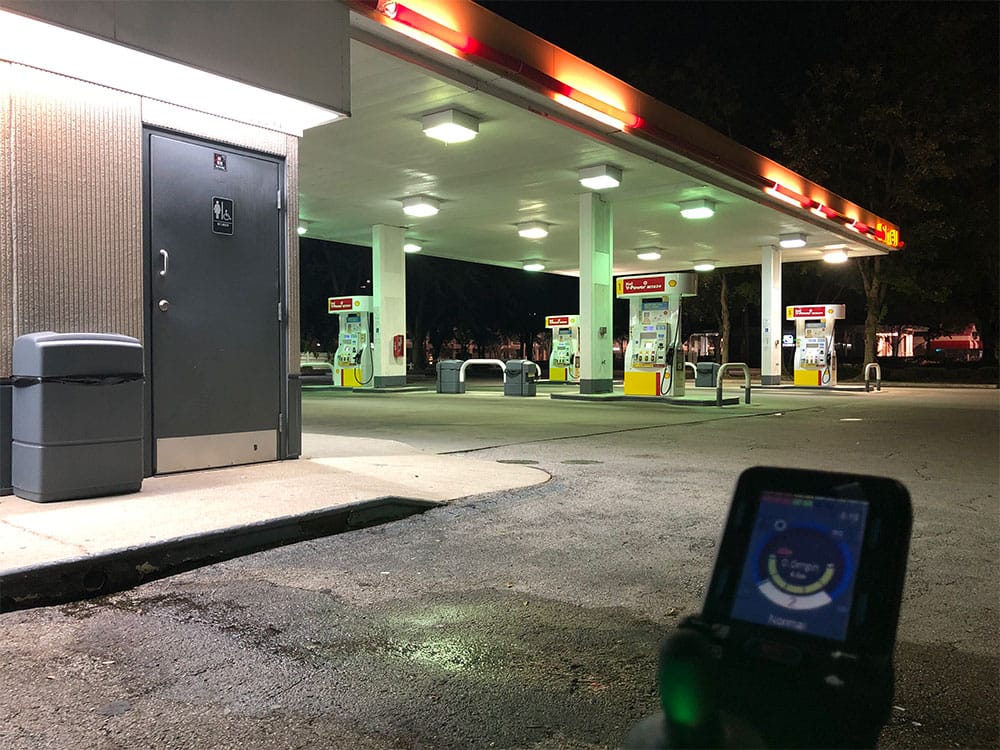 Wheelchair in parking lot of gas station.