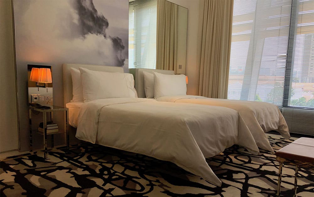 Two twin-sized beds at JW Marriott Singapore.