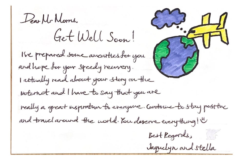 Get Well Soon card created by hotel staff, with drawing of the globe and an airplane. 