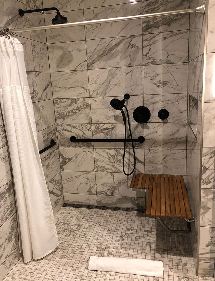 ADA accessible roll-in shower at Noelle Nashville Hotel.