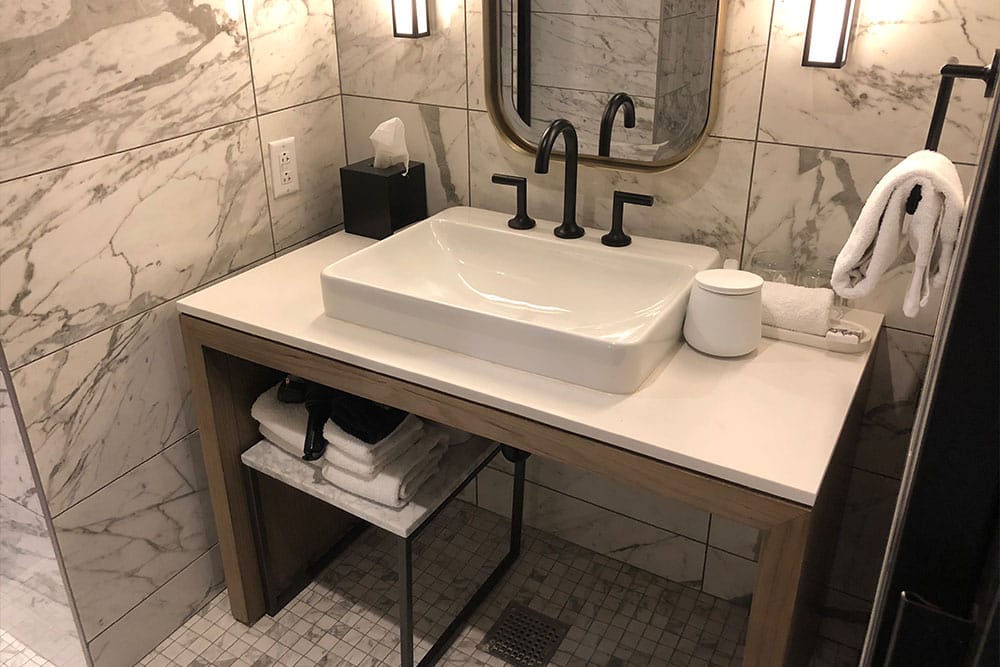 Bathroom sink with elevated basin.