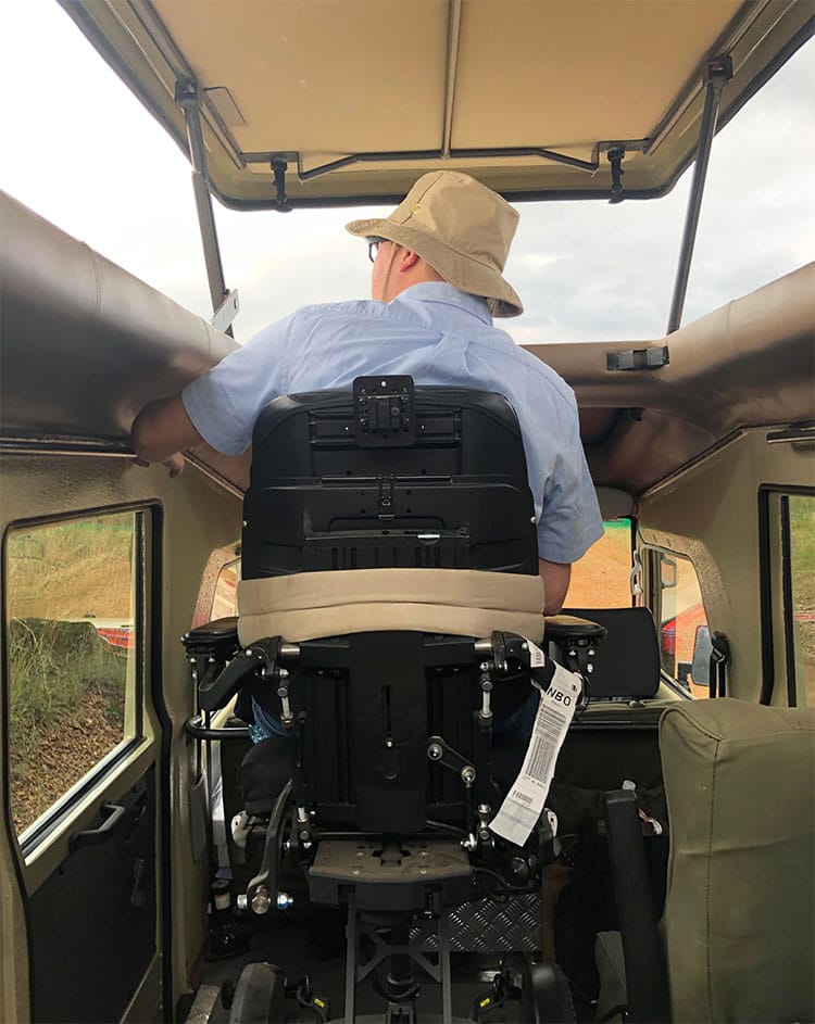 Wheelchair elevated to see out of the pop-up roof.