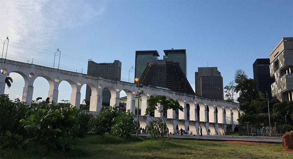 The arched Carioca Aqueduct with the Cathedral in background.