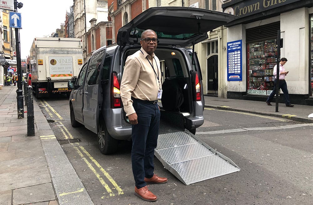 Wheelchair accessible Uber van with ramp in London, England.