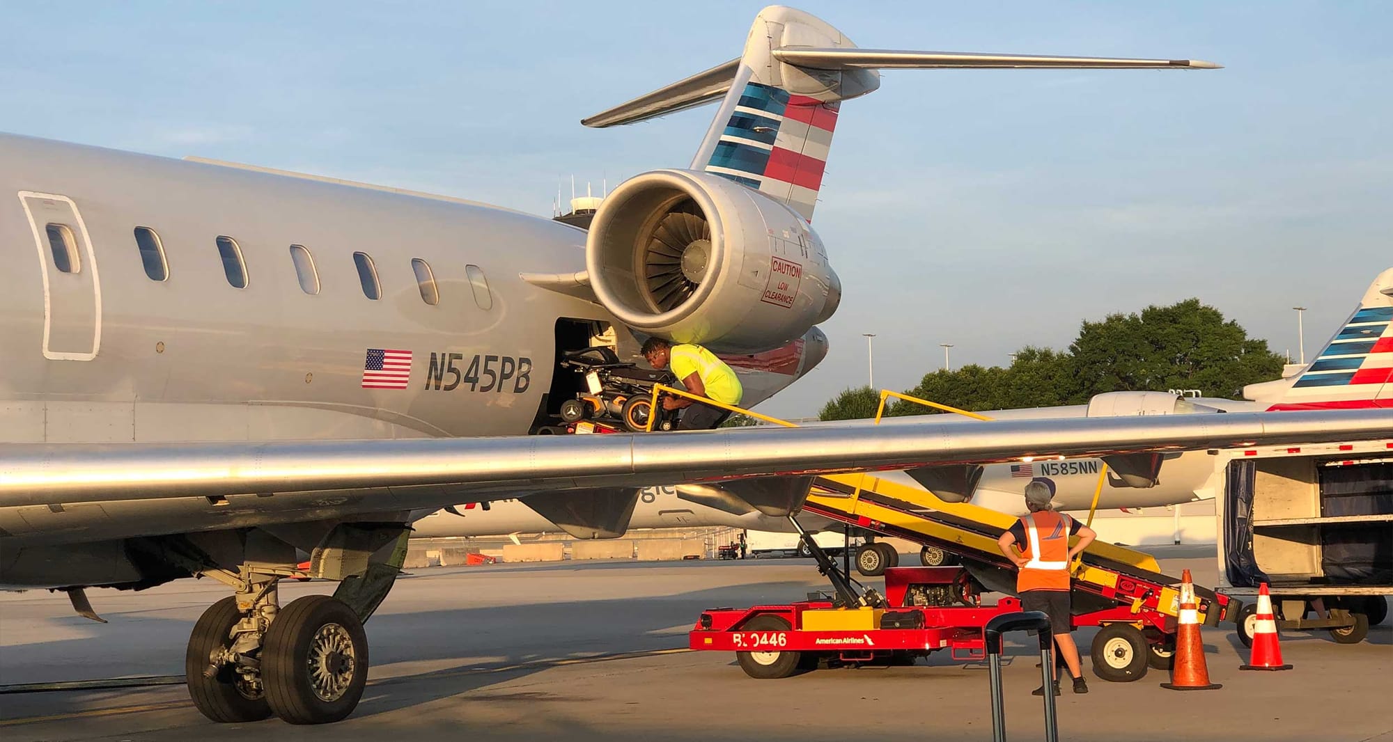 Power wheelchair loaded onto American Airlines CRJ-700 airplane.