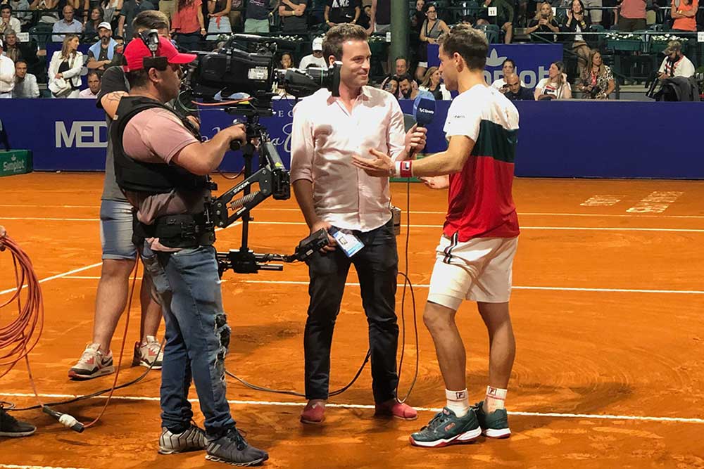 Diego Schwartzman being interviewed on the court.