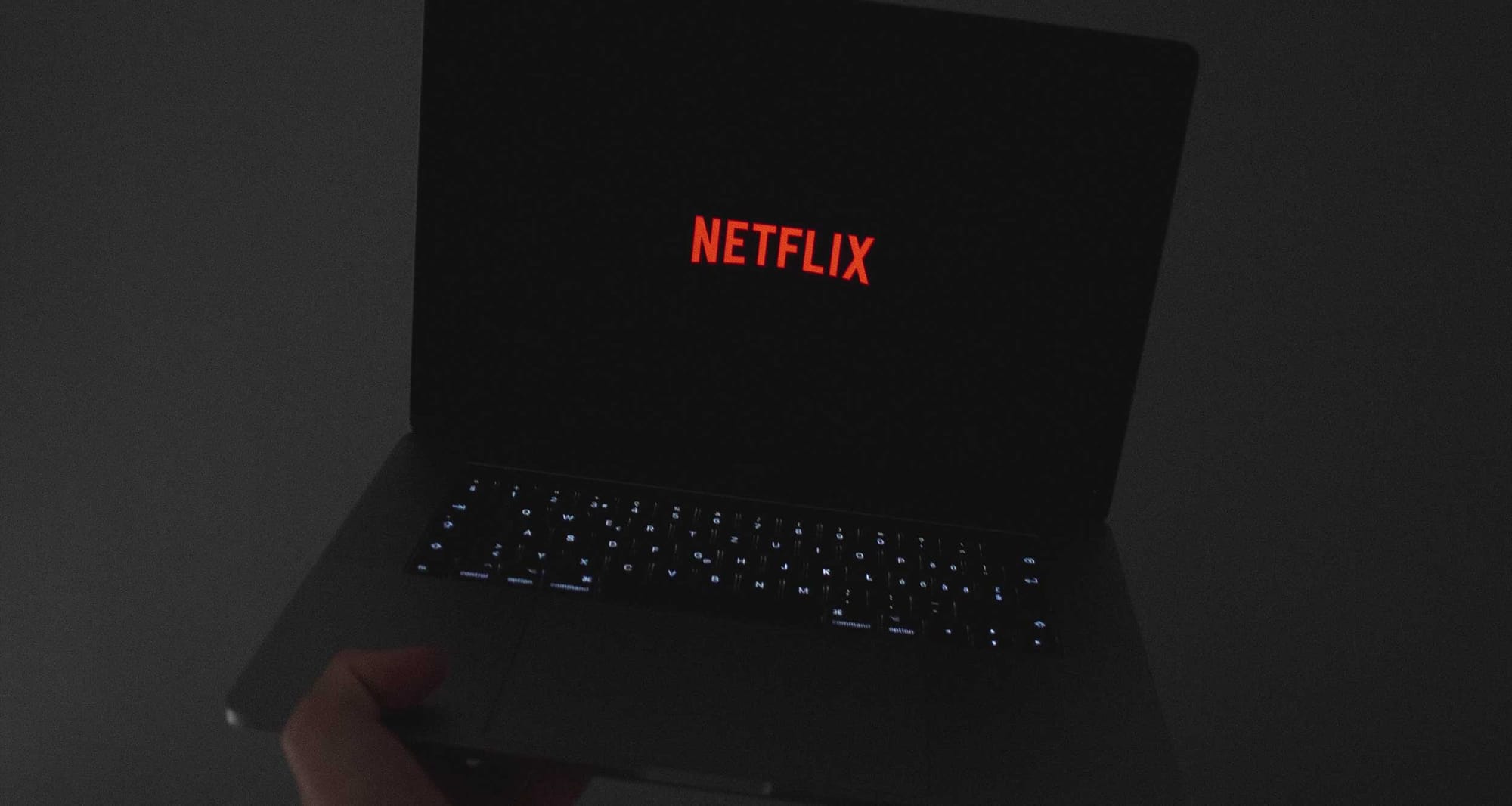 Netflix logo displayed on laptop computer screen.