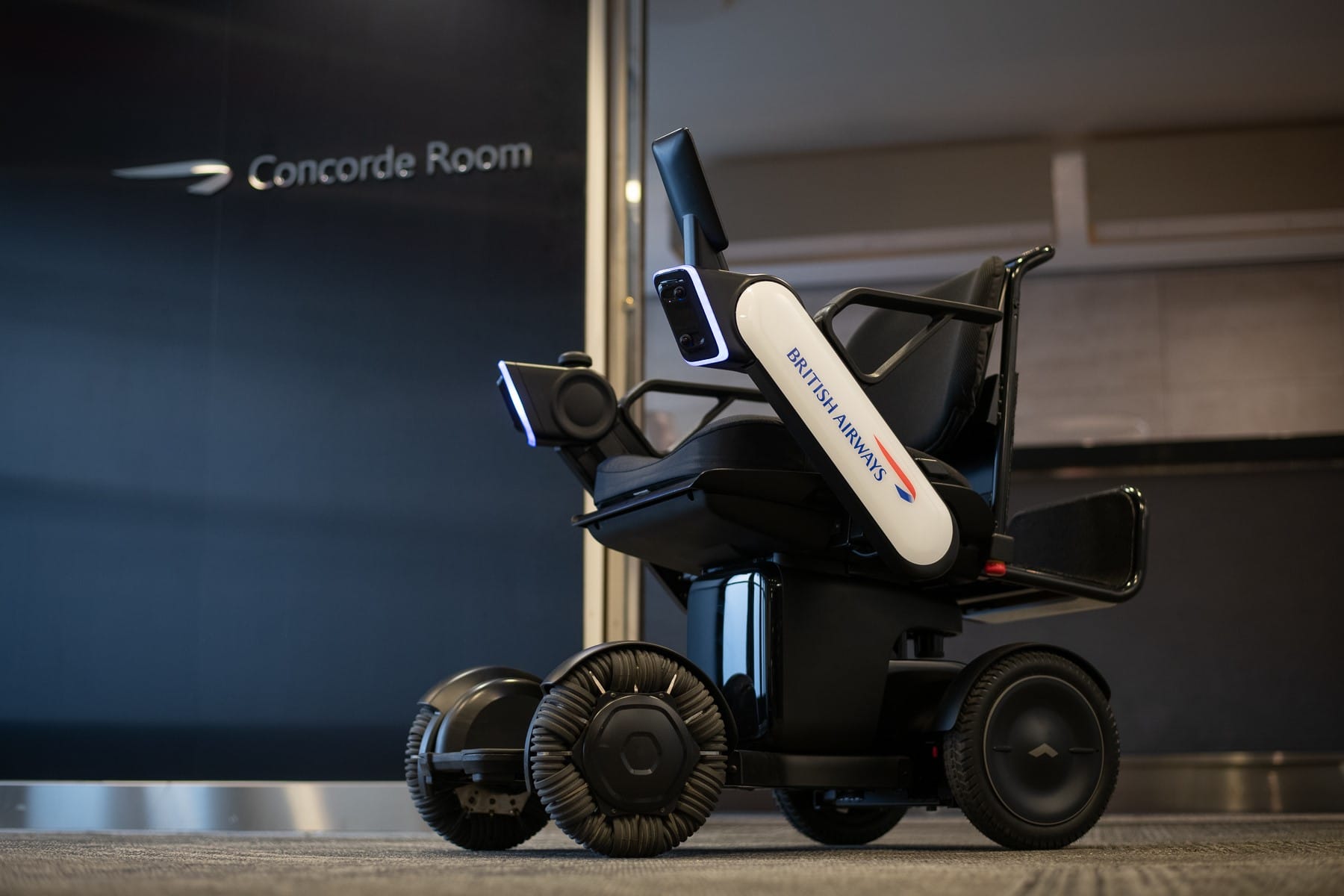 WHILL Model Ci autonomous wheelchair with British Airways branding.