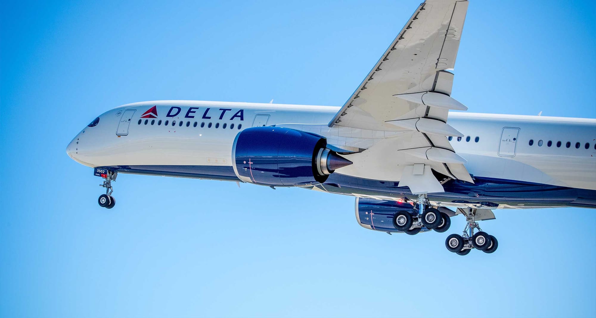 Delta Air Lines Airbus A350 in the air with landing gear retracted.