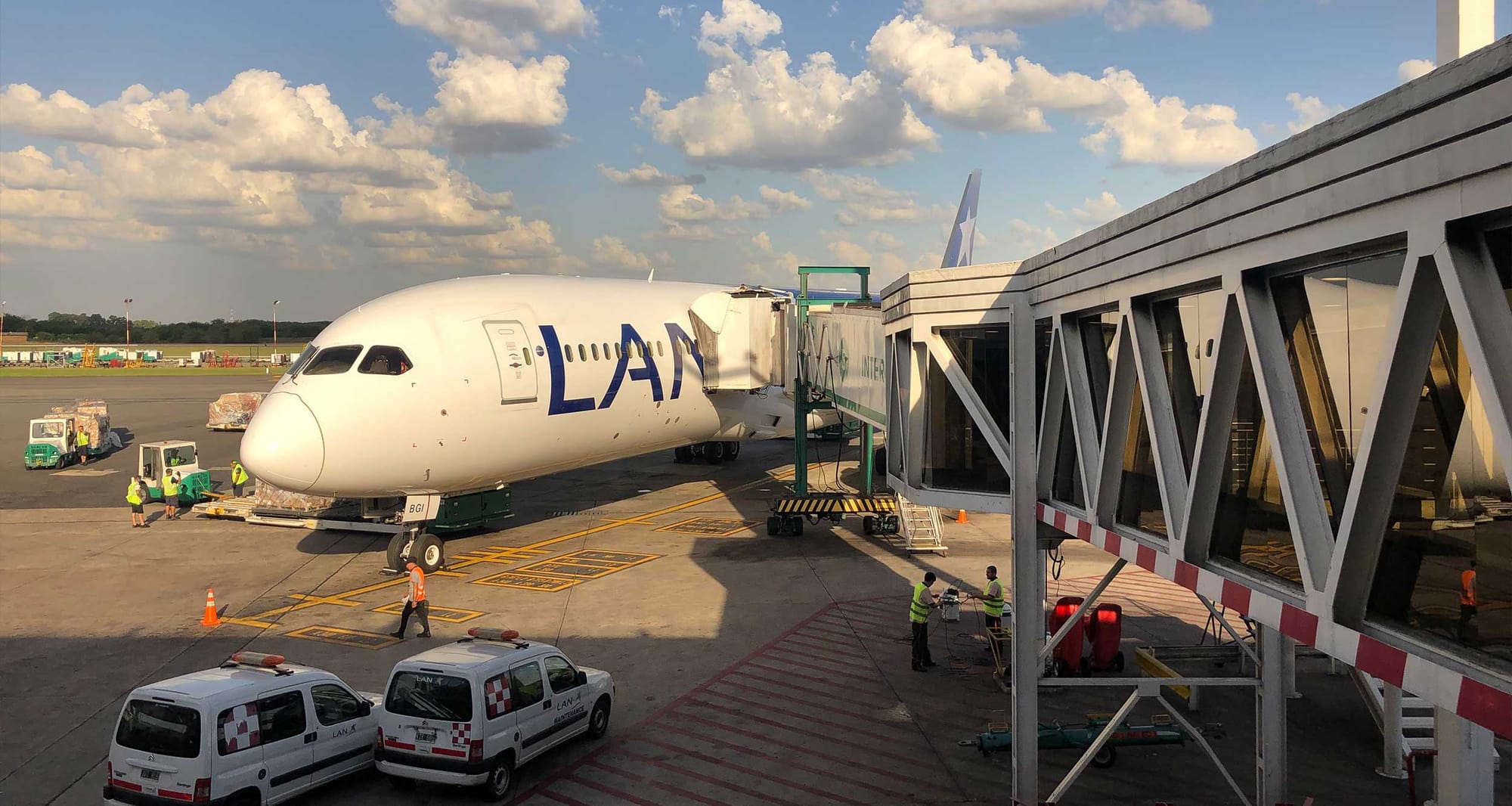 LATAM Airlines Boeing 787 connected to jet bridge at Buenos Aires Airport.