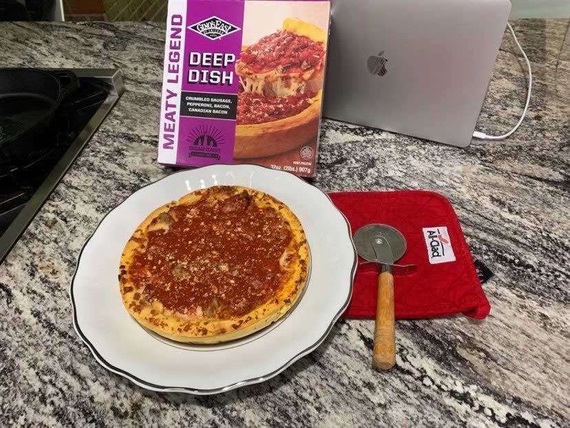 Deep dish pizza after being cooked.