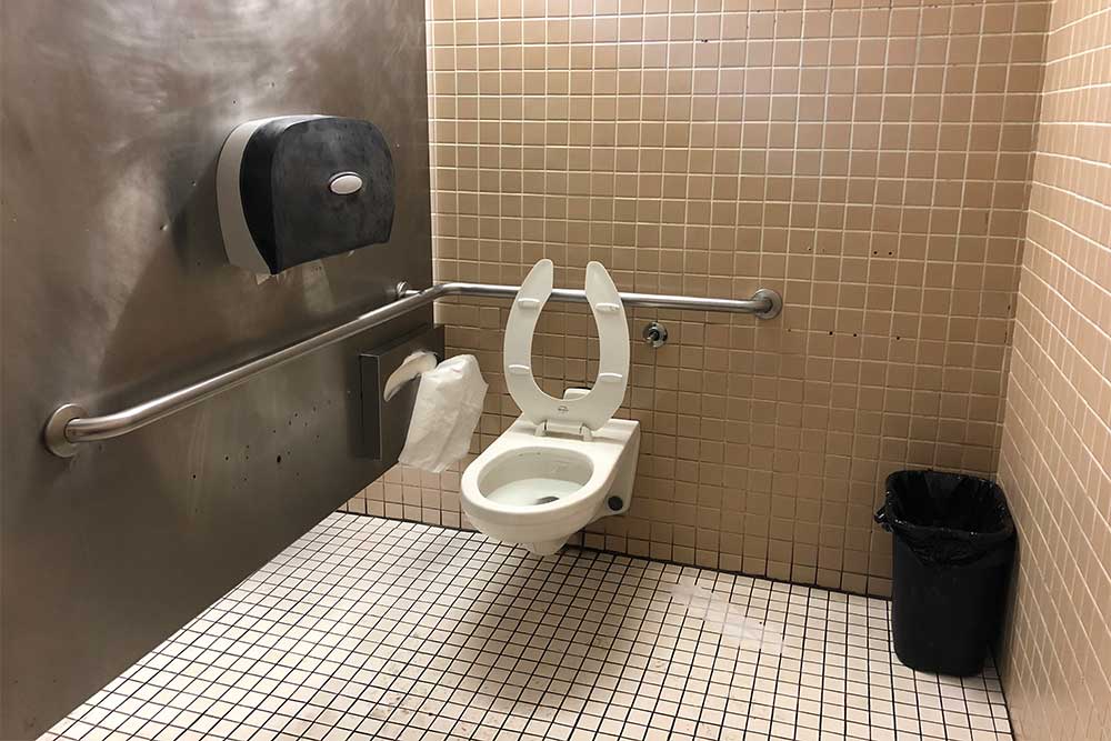 Wheelchair accessible toilet stall with grab bars.