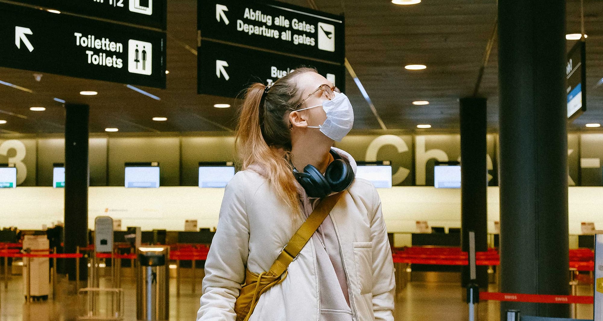 Woman wearing a mask in an airport.