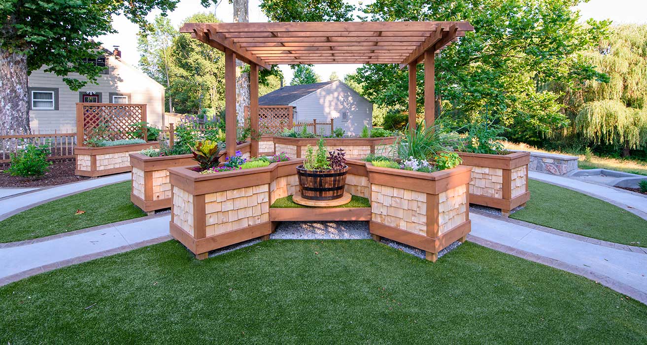 Wheelchair accessible garden with pathways and planters.