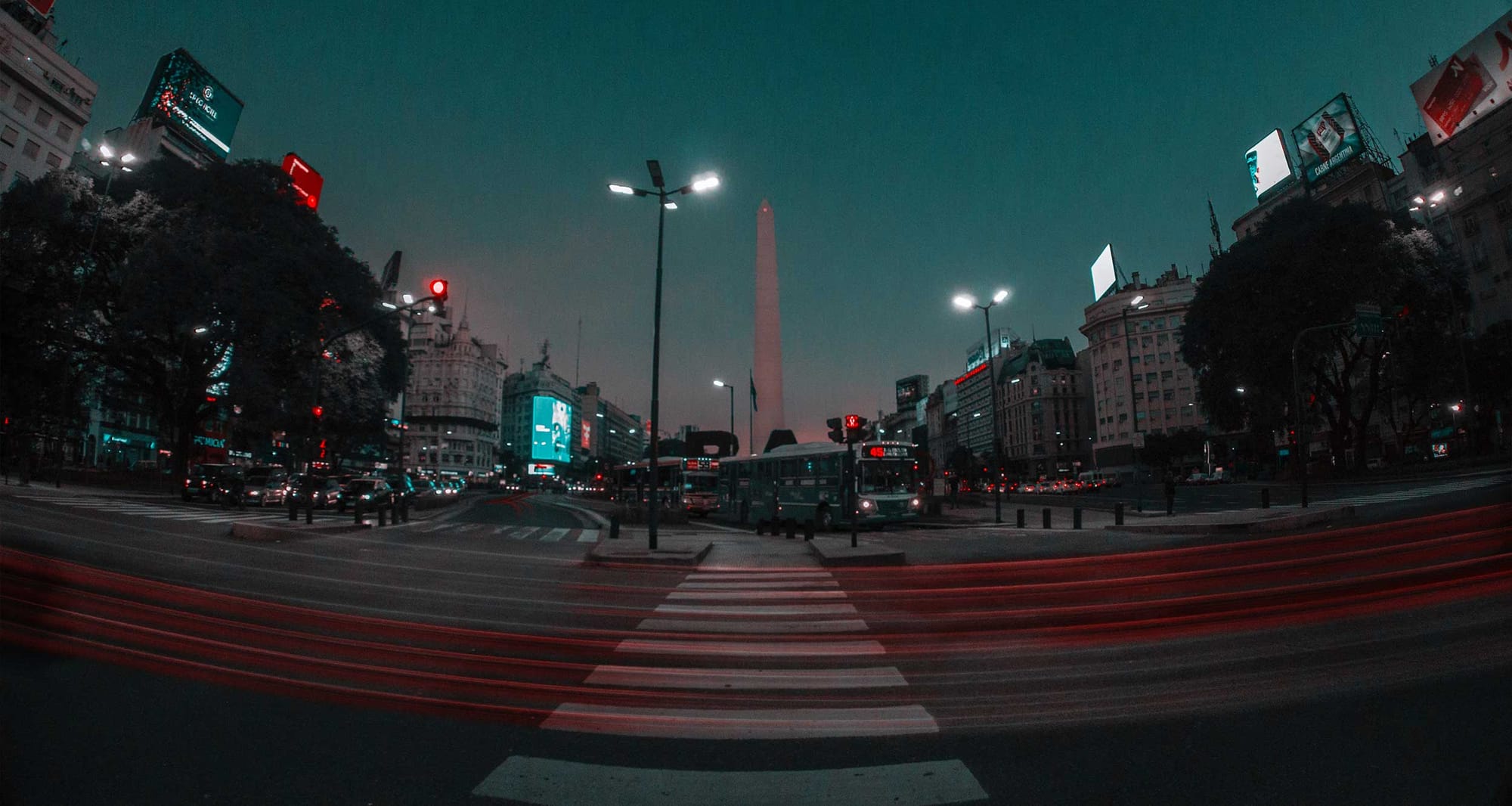 Buenos Aires sidewalk and street at night.