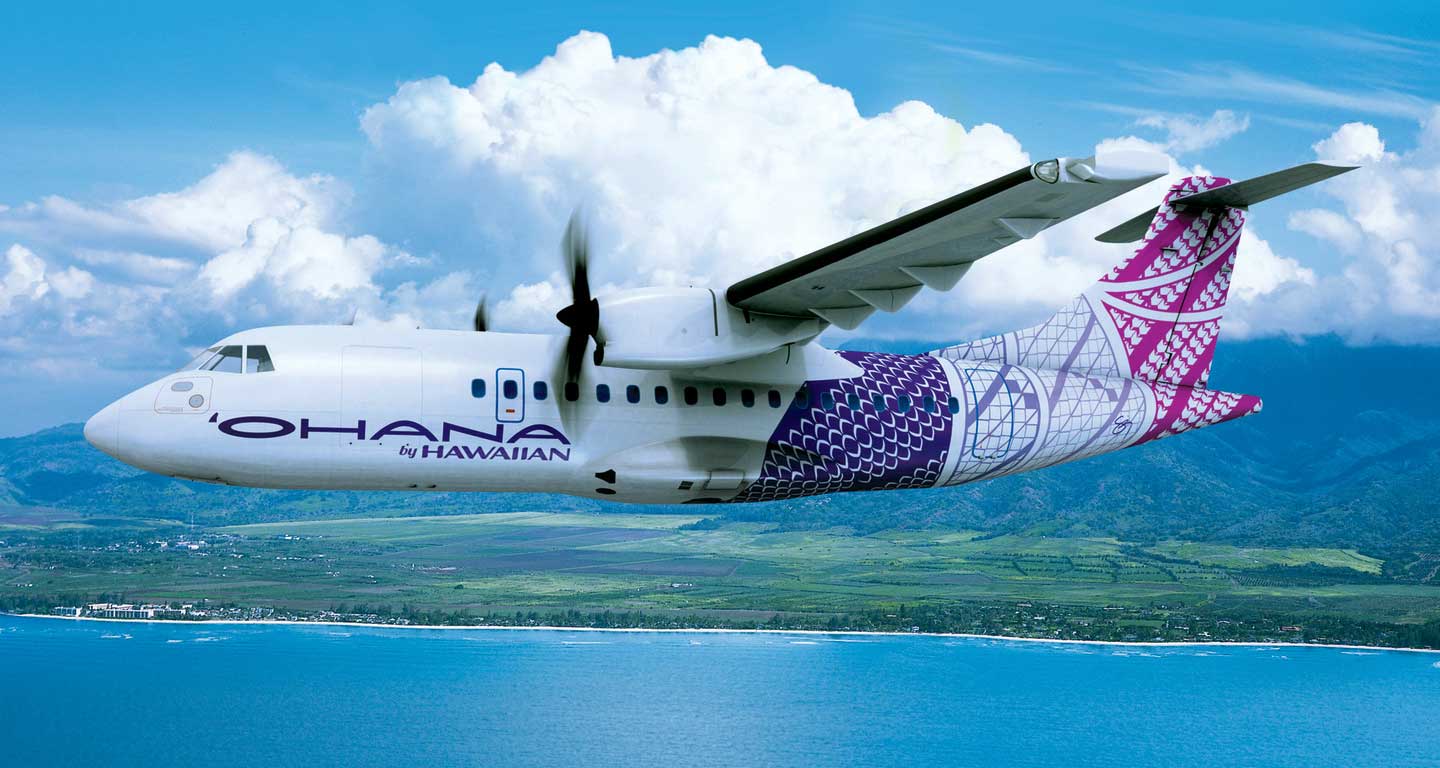 Ohana by Hawaiian ATR42 airplane flying along coastline.