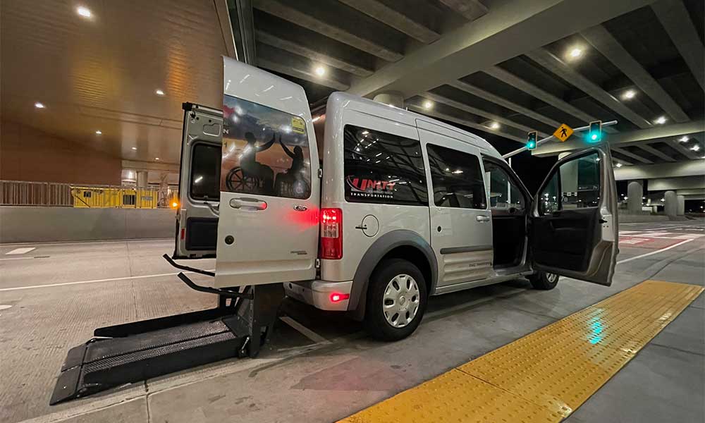 Van with wheelchair lift at rear of vehicle.