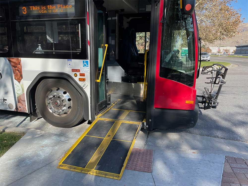 City bus with wheelchair ramp extended.