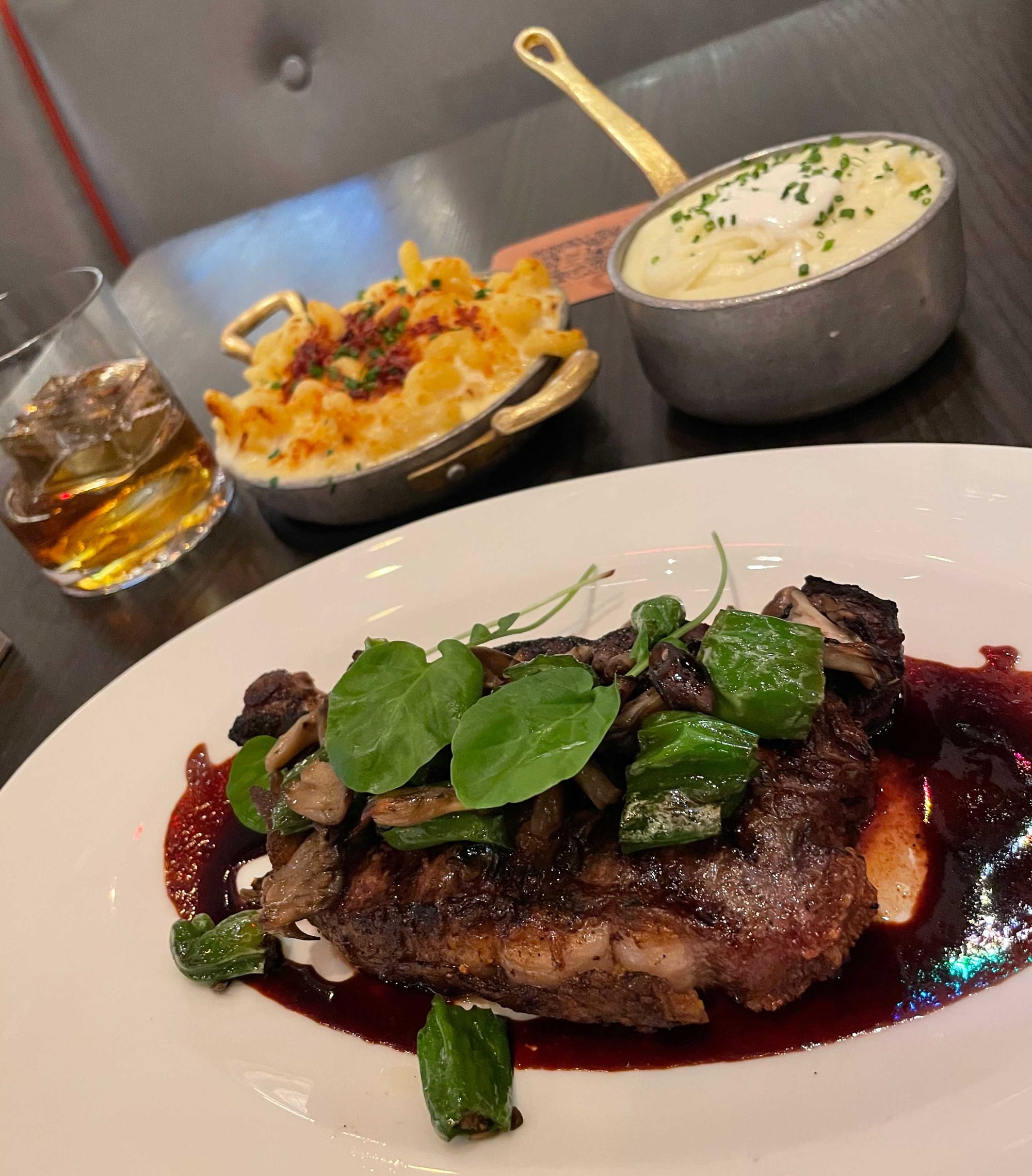 New York Strip steak with mashed potatoes and macaroni & cheese.