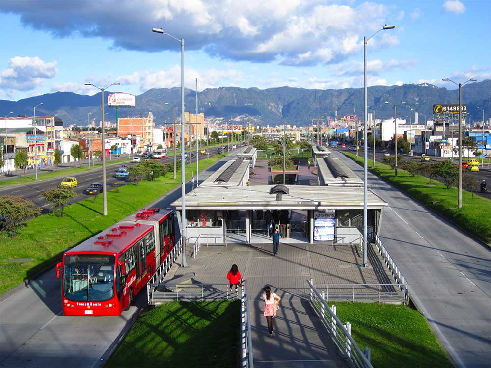 Bus parked alongside island platform bus station.