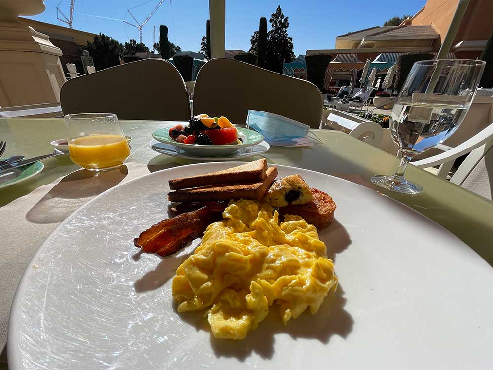 American breakfast with eggs, bacon, fruit and toast.