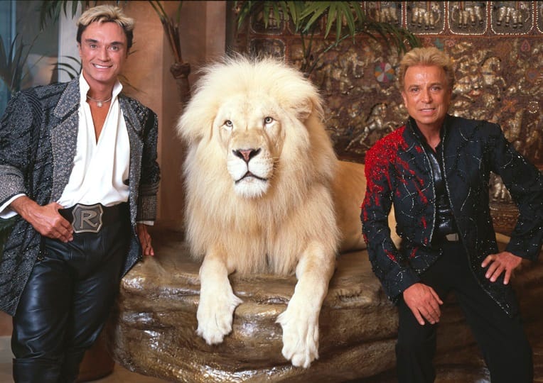 Siegfried and Roy with an adult male tiger.