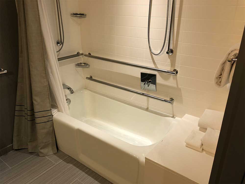 Bathtub with grab bars.