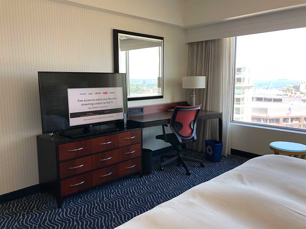 TV and desk across from bed.