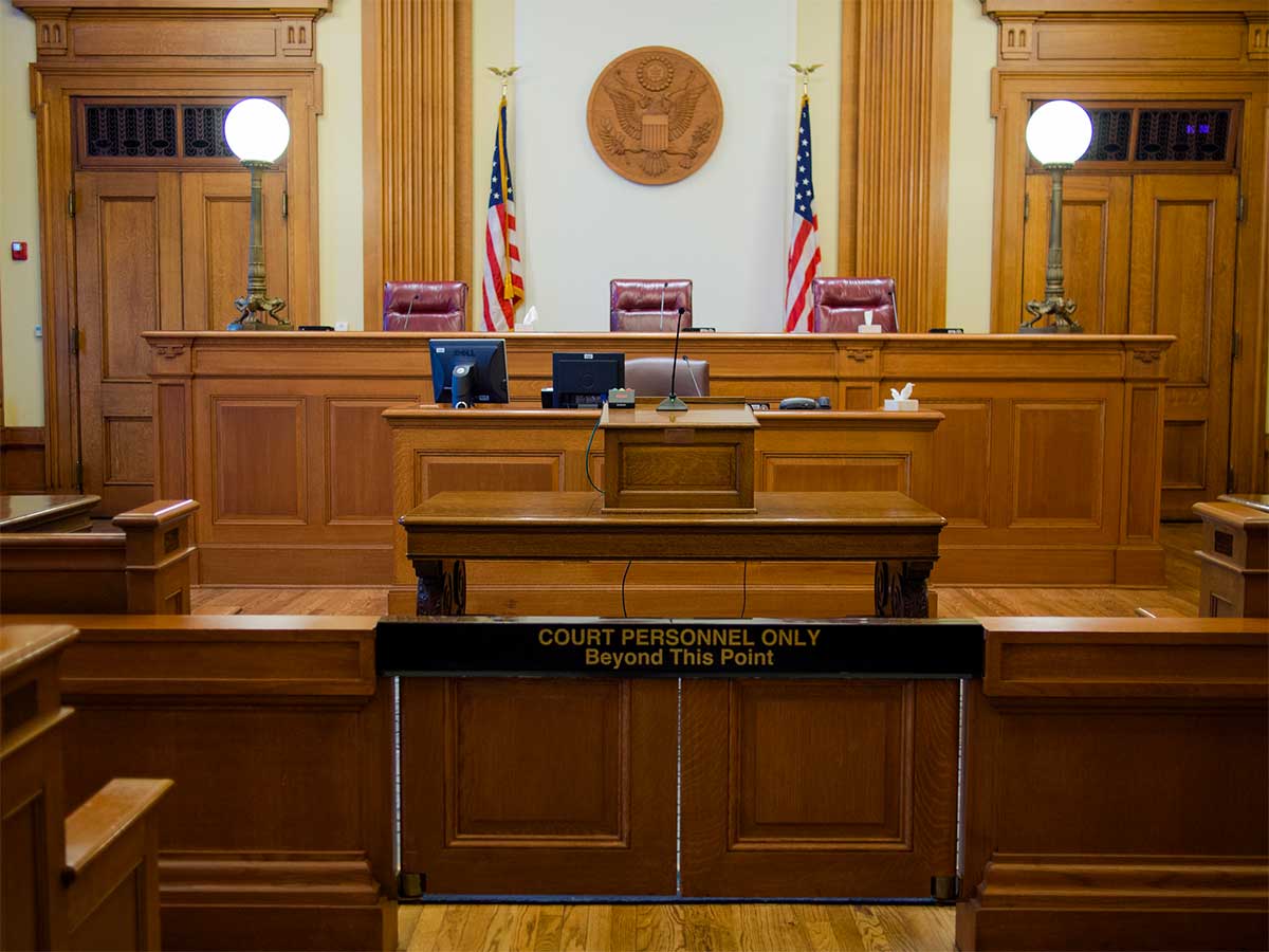 Courtroom with seats for three judges.