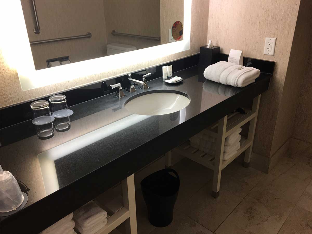 Bathroom sink with long counter.