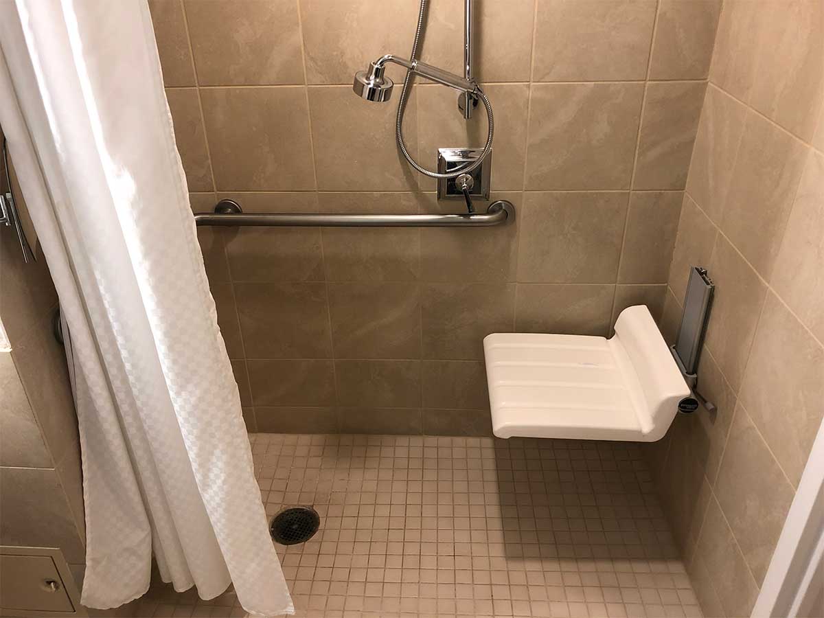 Roll-in shower with built in seat.