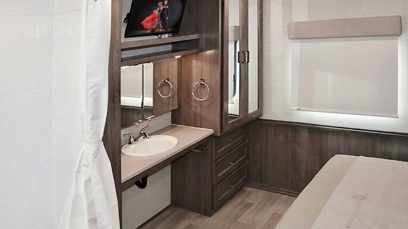 Accessible sink across from bed.