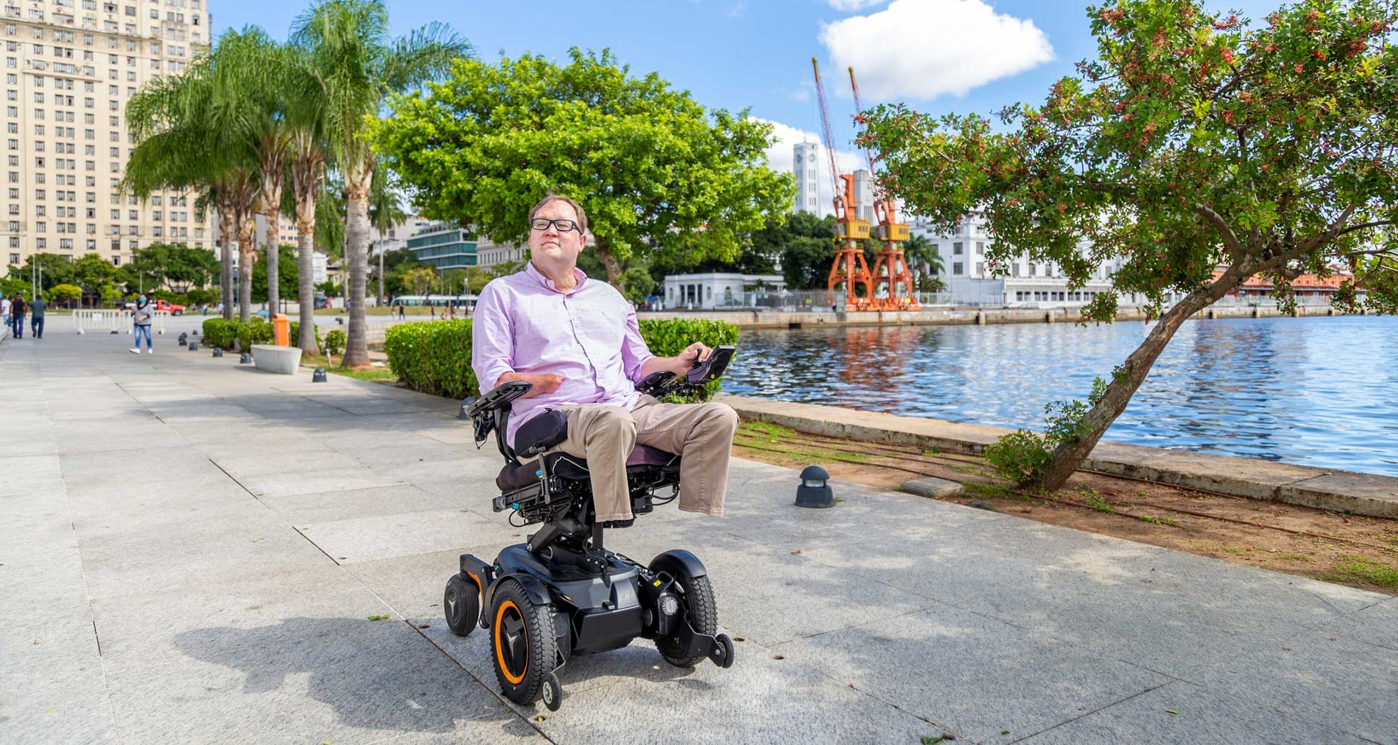 John rolling in his wheelchair in the Centro district of Rio de Janeiro.