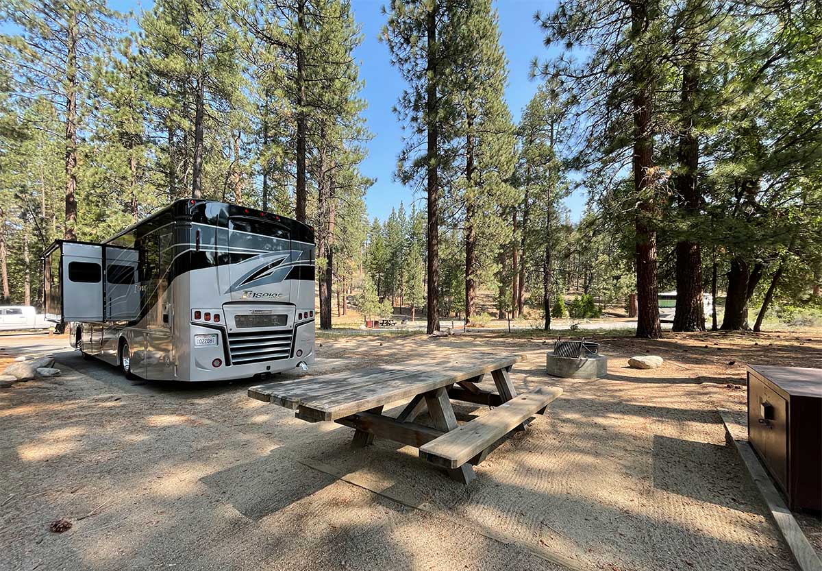 Winnebago Inspire RV parked at campsite.