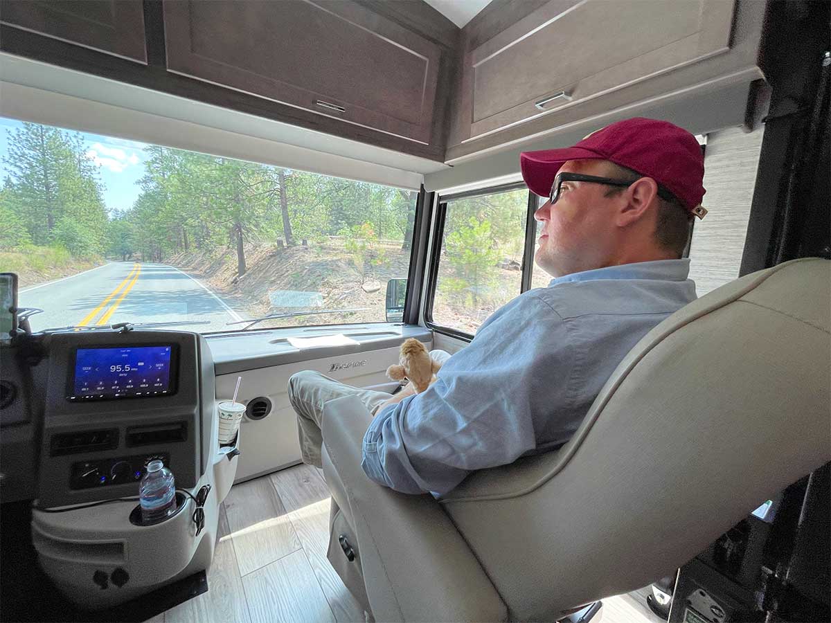 John sitting in Winnebago Inspire's front passenger seat.