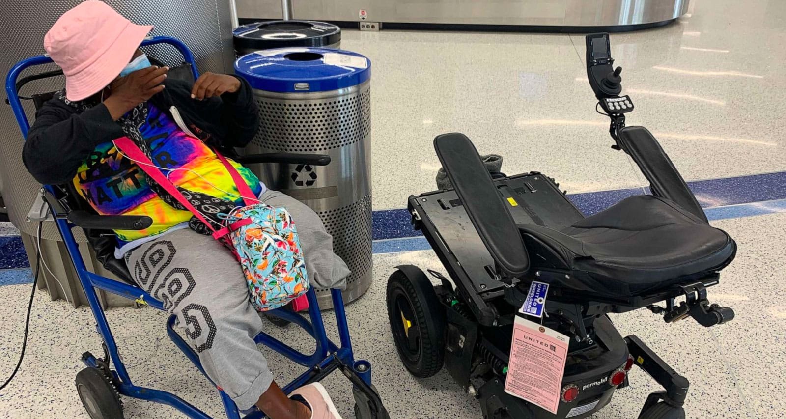 Engracia Figueroa sitting in an airport wheelchair next to her damaged power wheelchair.