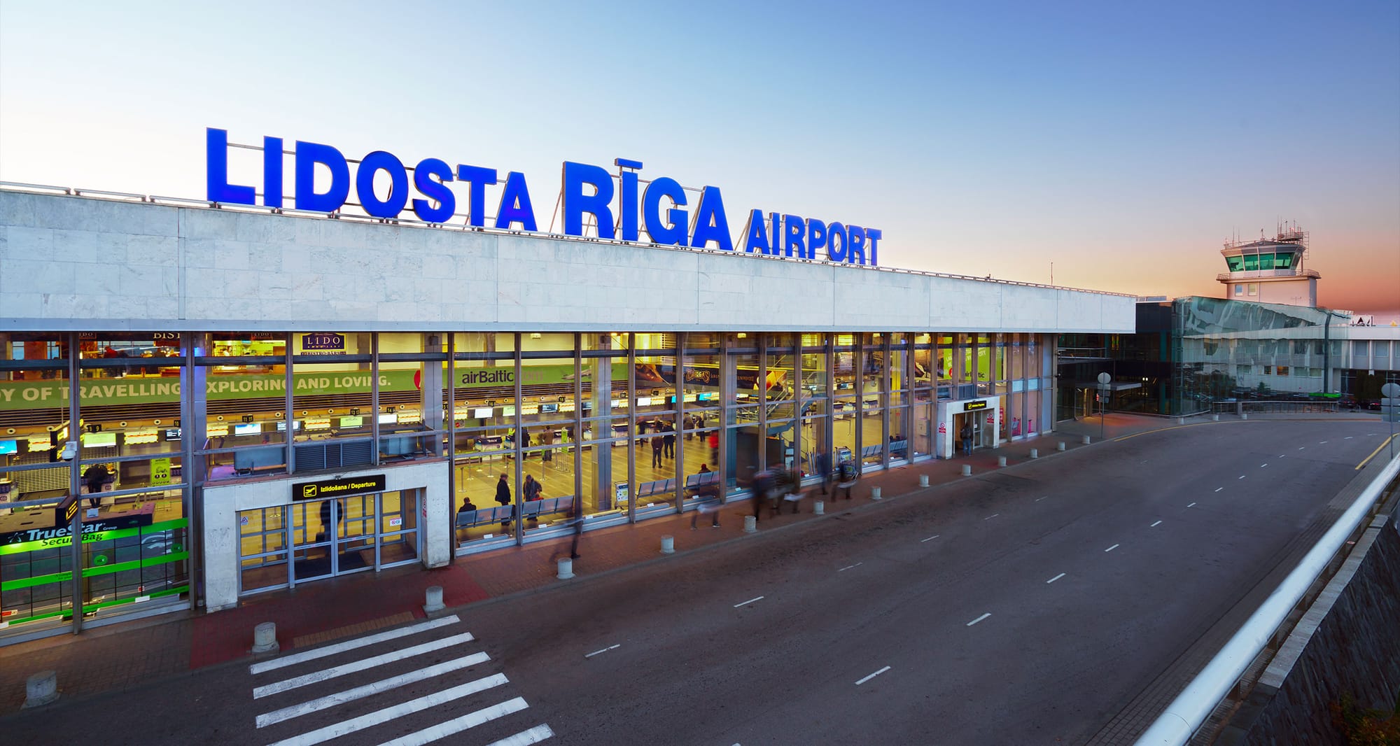 Exterior of wheelchair accessible Riga Airport terminal.