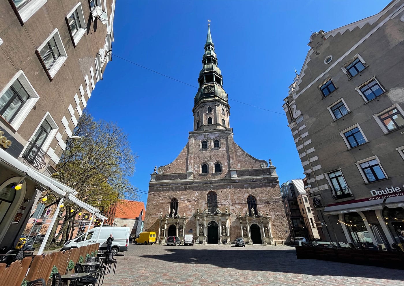 Front facade of iconic church with towering spire.