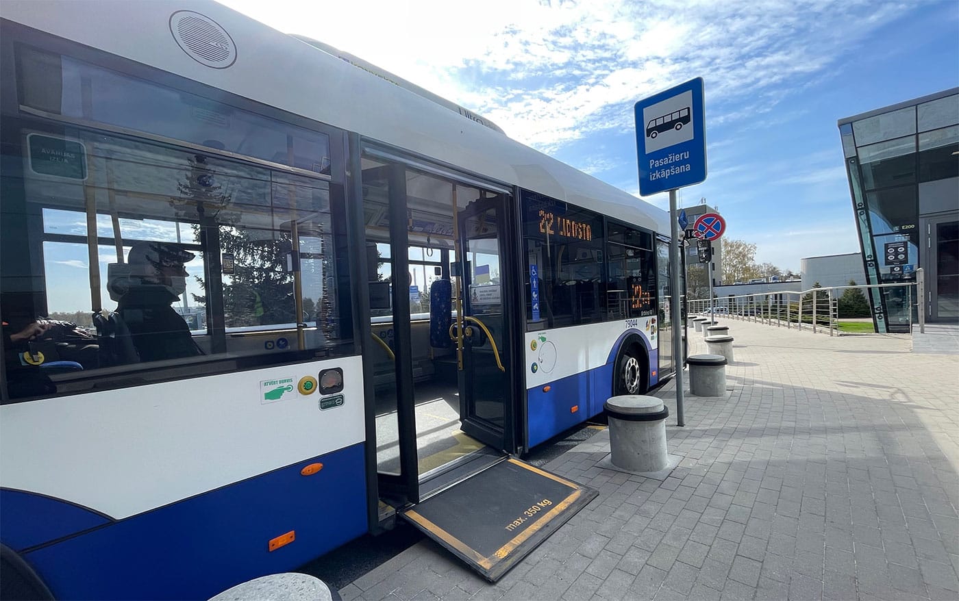 City bus with wheelchair ramp extended.