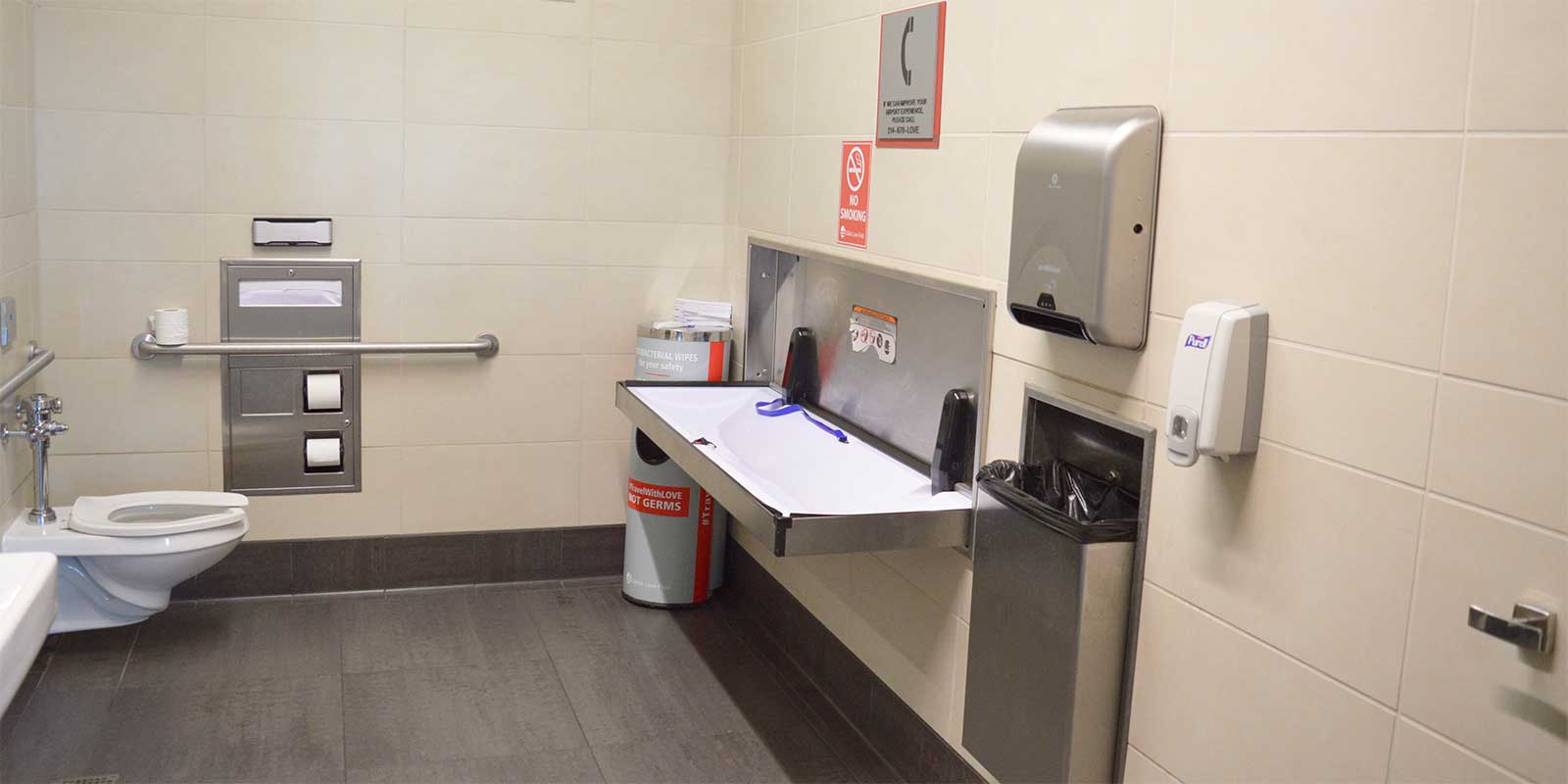 Adult changing table that folds down from wall.