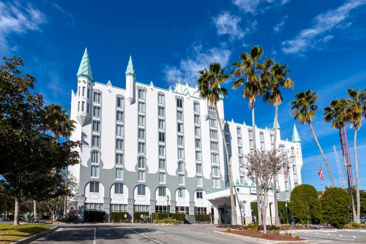 Exterior of a hotel that looks like a castle with spires and turrets.