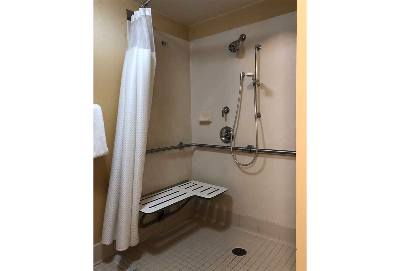 Roll-in shower with built in seat.